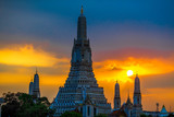 Fototapeta Paryż - Wat Arun Ratchawararam Ratchawaramahawihan- Bangkok: Location at Chao Phraya River cruise tourists, dining on the boat and watch the evening light on the river, in Phranakhon, Thailand
