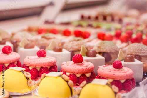Fotografía Various beautiful delicious pastries on a showcase in a French shop