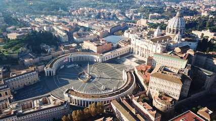aerial drone view of saint peter's square in front of world's largest church - papal basilica of st.