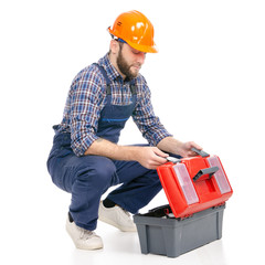 Wall Mural - Young man builder with toolbox industry worker hardhat on white background isolation