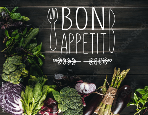 Plakaty do jadalni top-view-of-different-fresh-vegetables-on-wooden-tabletop-with-copy-space-bon-appetit-lettering