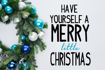 Wall Mural - top view of decorative festive wreath with blue and silver christmas toys isolated on white with 