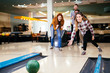 © NDABCREATIVITY - Friends bowling at club