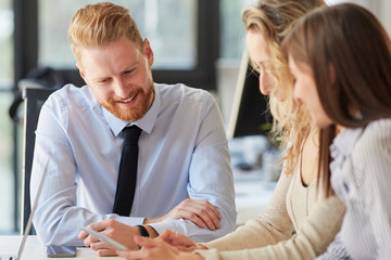 Startup concept - creative team talking in office