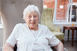 © Monkey Business - Portrait Of Senior Woman Sitting In Chair In Lounge Of Retirement Home