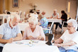 © Monkey Business - Group Of Seniors Playing Game Of Bingo In Retirement Home