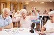 © Monkey Business - Senior Woman Winning Game Of Bingo In Retirement Home
