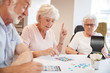 © Monkey Business - Group Of Seniors Playing Game Of Bingo In Retirement Home