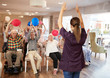 © Monkey Business - Carer Leading Group Of Seniors In Fitness Class In Retirement Home