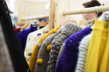 Colorful clothes on hangers