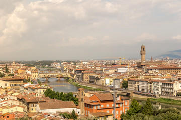 Cityscape of Florence, Italy. Beautiful view of Firenze with famous Ponte Vecchio bridge over the river Arno