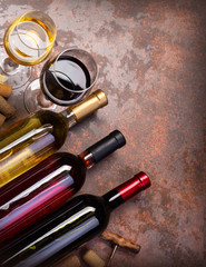 wine bottles and glass on table with copy space