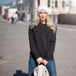 Street fashion look. Beautiful girl in black hoody