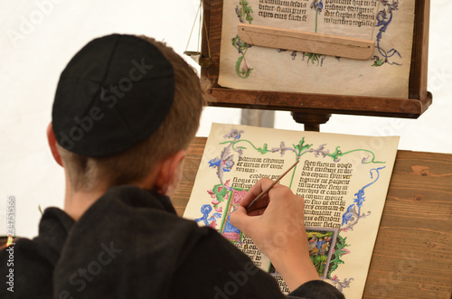 Cuadros en Lienzo Young male medieval scribe make manuscript - calligraphy