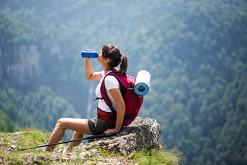 hiker girl drinking water
