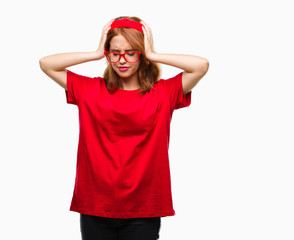 Canvas Print - Young beautiful woman over isolated background suffering from headache desperate and stressed because pain and migraine. Hands on head.