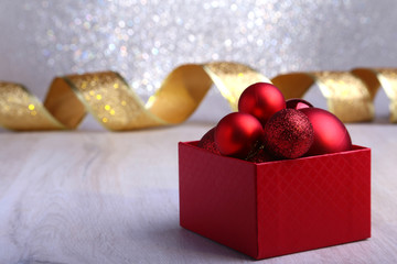 Wall Mural - Colorful red gifts with Christmas balls isolated on silver background