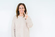 © Krakenimages.com - Beautiful middle age woman over isolated background showing and pointing up with fingers number two while smiling confident and happy.