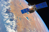 Low-orbit communication satellite in space above the Earth. Elements of this image furnished by NASA.