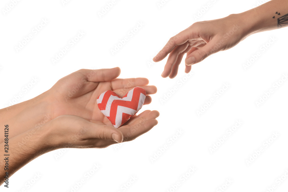 Man and woman with small heart on white background