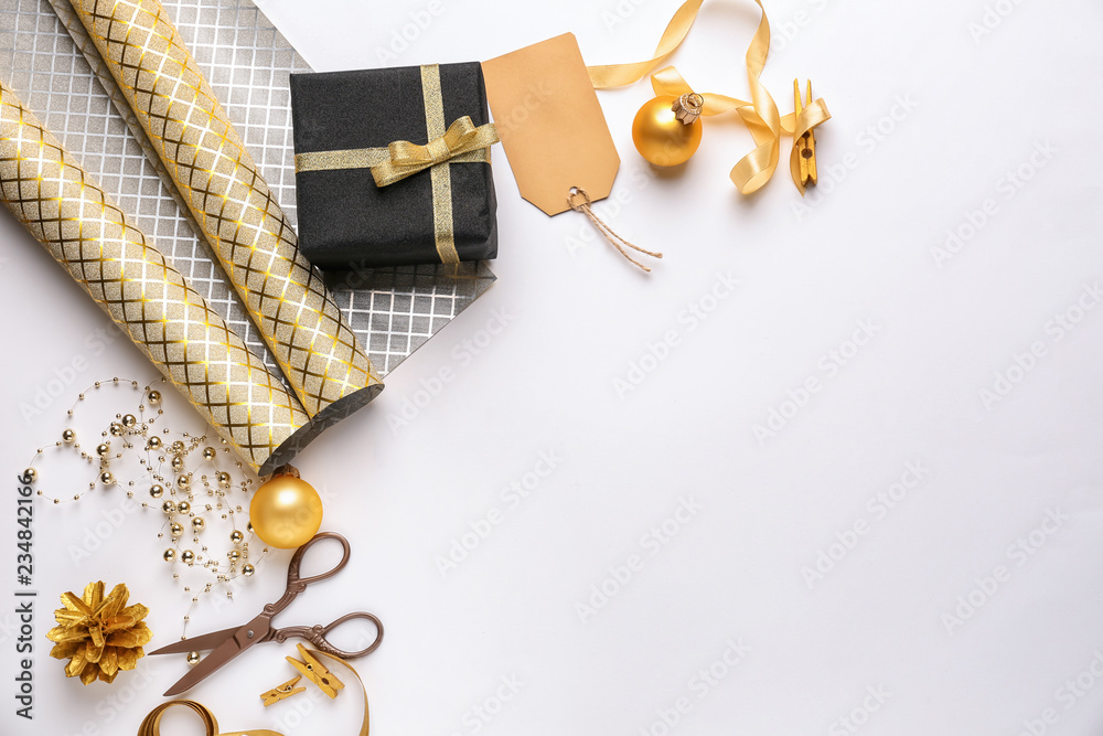 Beautiful Christmas gift with decorations on white background