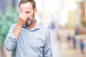 Wall Mural - Middle age hoary senior business man over isolated background tired rubbing nose and eyes feeling fatigue and headache. Stress and frustration concept.