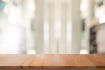 Wall Mural - wooden desk with abstract blurred livingroom decoration interior for background