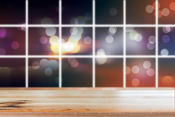 Canvas Print - wooden desk with blurred light bokeh abstract background