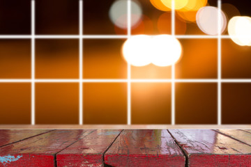 Canvas Print - wooden desk with blurred light bokeh abstract background