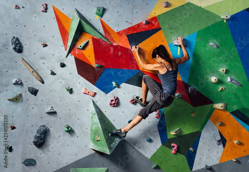 Woman on climbing wall Poster Mural XXL
