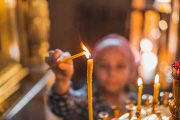 Wall Mural - church candles burn in prayer