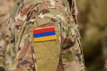 Flag of Armenia on soldiers arm (collage).