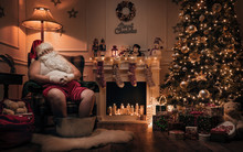 Santa Claus Relaxing After Or Before Work In Cozy Christmas Room