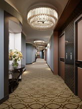 Luxurious Modern Corridor With Blue Walls, Decorative Niches With Consoles And Glass Chandeliers. Interior Design Of The Hall With A Door To The Hotel Rooms.