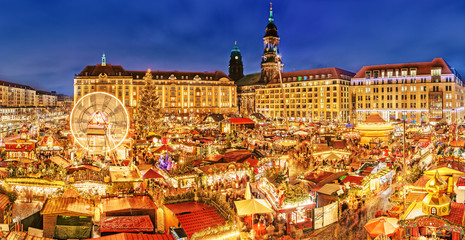 Wall Mural - Dresden Christmas market, view from above, Germany, Europe. Christmas markets is traditional European Winter Vacation activities in December. Circled carousel, stalls and people choosing presents.