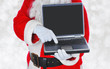 © Steve Cukrov - Santa Claus holding a laptop computer shopping on Cyber Monday