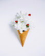 Lovely bouquet flower in ice cream cone on white background. Floral arrangement, flat lay styling. Top view.