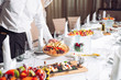 © davit85 - Waiter serving table in the restaurant preparing to receive guests.
