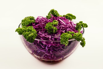 Canvas Print - Red cabbage salad in a plate on a white background