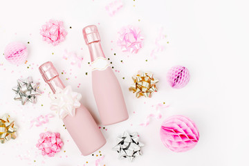 Sticker - Pale Pink Mini bottles of champagne with confetti and tinsel. Flat lay. New year/Christmas celebration or wedding  concept theme. Flat lay, top view