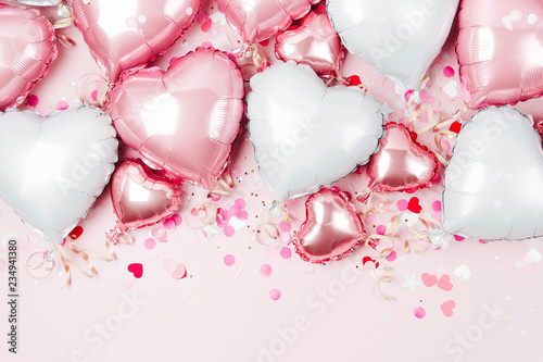 Air Balloons of heart shaped foil on pastel pink background Poster Mural XXL