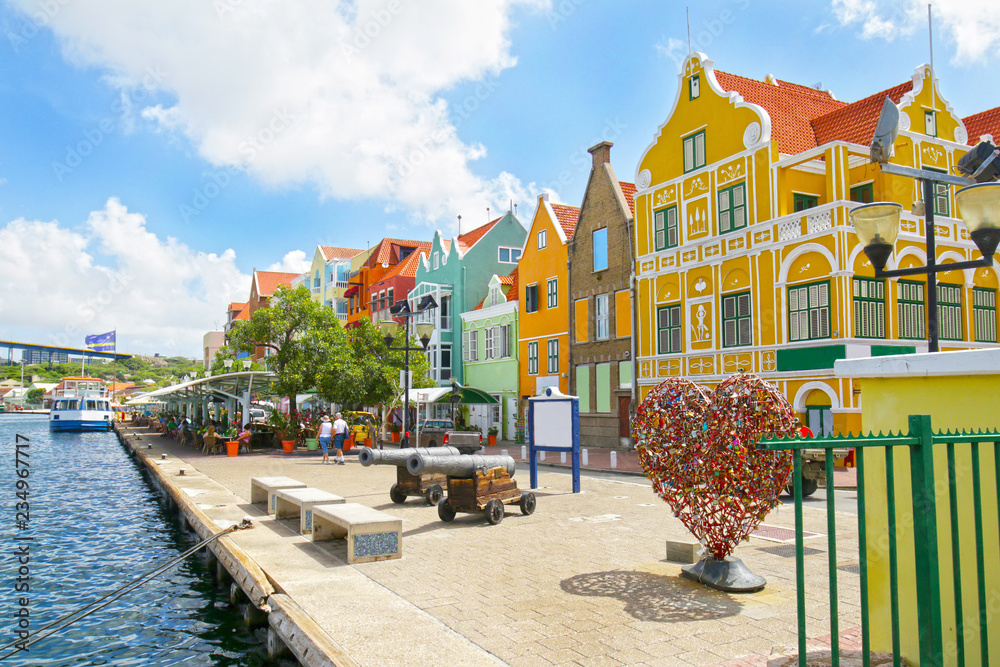 Willemstad, Curacao, Netherlands Antilles. Colourful houses and commercial buildings of Punda, Willemstad Harbor, on the Caribbean island of Curacao, Netherlands Antilles - obrazy, fototapety, plakaty 