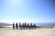 Team of bikers are looking at the Atlantic ocean in Portugal