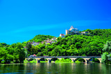 Fototapeta Boho - A view of the medieval fortress of Castelnaud La Chapelle high above the Dordogne River in Aquitaine, France