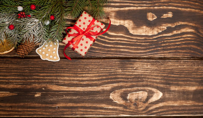 Wall Mural - Christmas fir tree with decoration on a wooden board. Copy-space for text