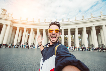 Wall Mural - Selfie of a beatiful caucasian man tourist in Rome at Vatican city on vacation