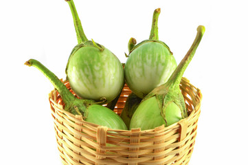 green eggplant isolated on white background / thai green eggplant in basket harvest vegetable garden