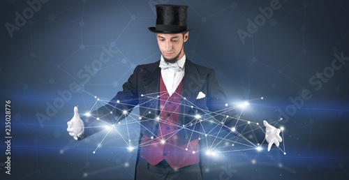 Fotografia Magician with blue background and geometrical connection between two hands