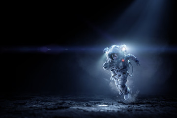 Wall Mural - Spaceman running fast. Mixed media