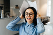 © mnelen.com - smiling successful business woman in glasses working in a cafe, freelancing, holding documents